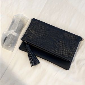 Never been used Gigi NY faux snake skin clutch